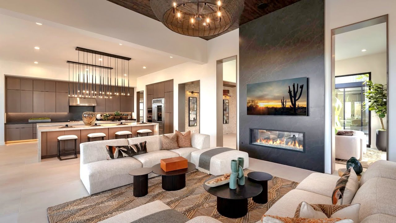 Bright modern interior with designer sofa, arc lamp, and curated coffee table